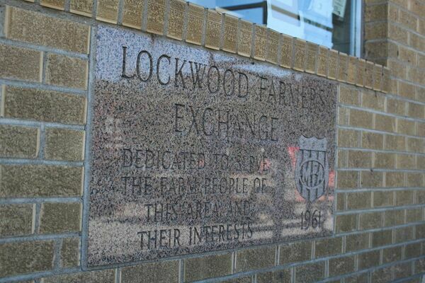 The dedication stone embedded in the wall of the Lockwood Farmers Exchange facility constructed in 1961.