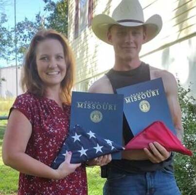 Representative Kelley presenting Dustin Harmon with flags that were flown over the Missouri Capitol on Friday , July 28th, which was the day he graduated from Marine boot camp.